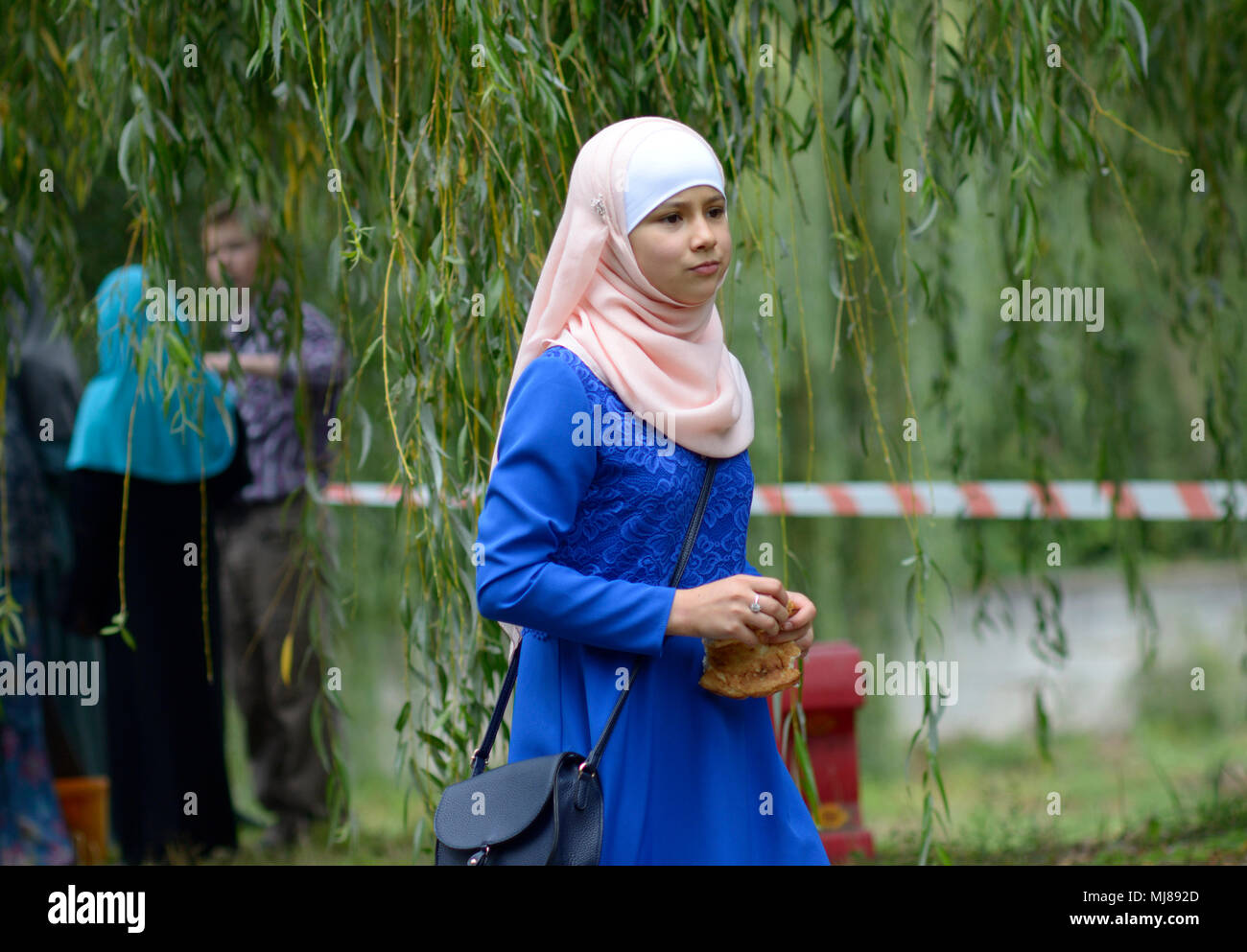 Muslim girl wearing hijab during celebration of Hidirellez (festival of arrival of spring). Kiev, Ukraine Stock Photo