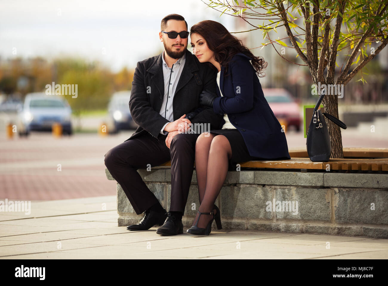 Young fashion couple in love on city street Stock Photo