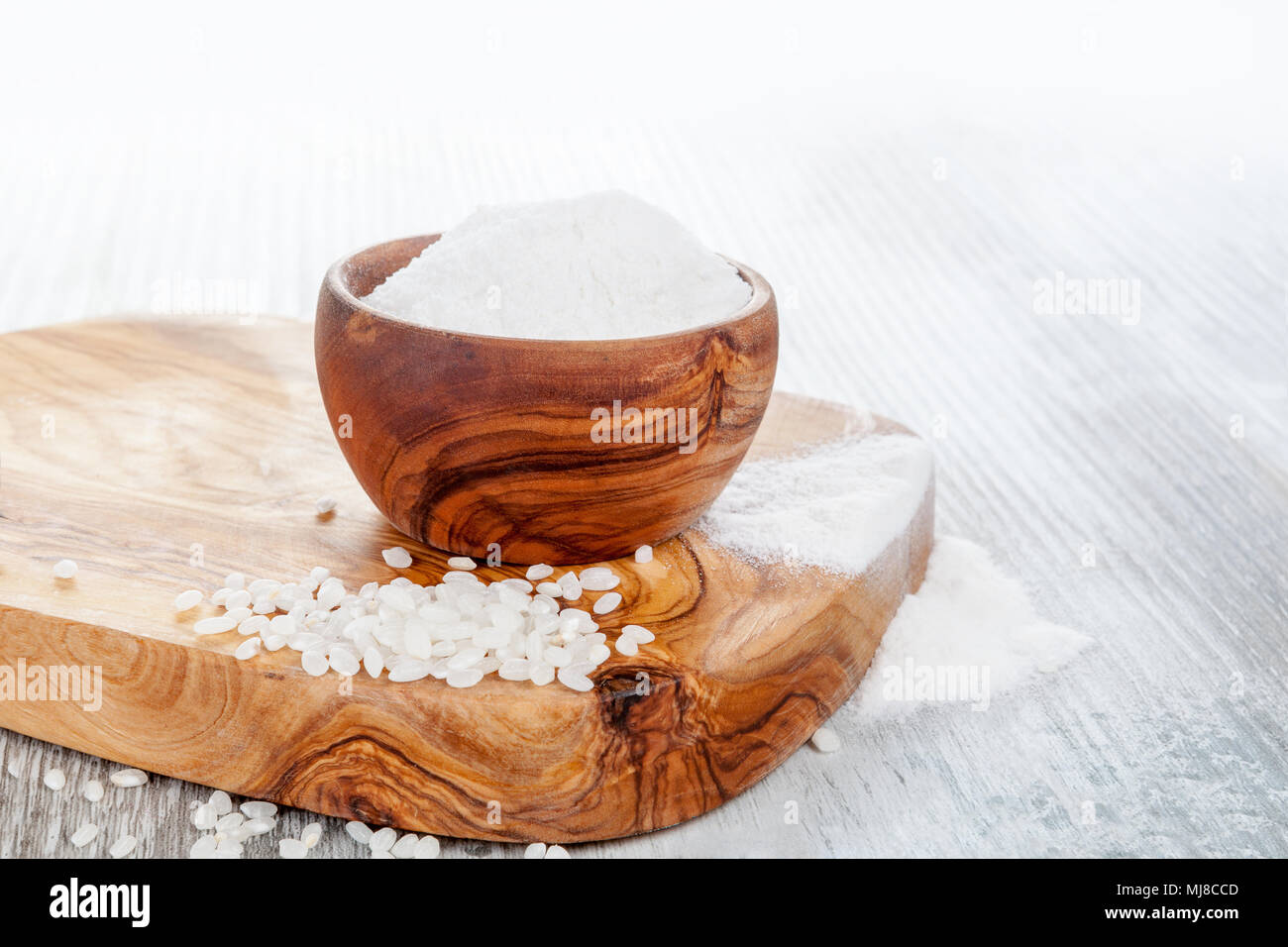 Gluten free rice flour in a wooden bowl for celiac disease people Stock ...