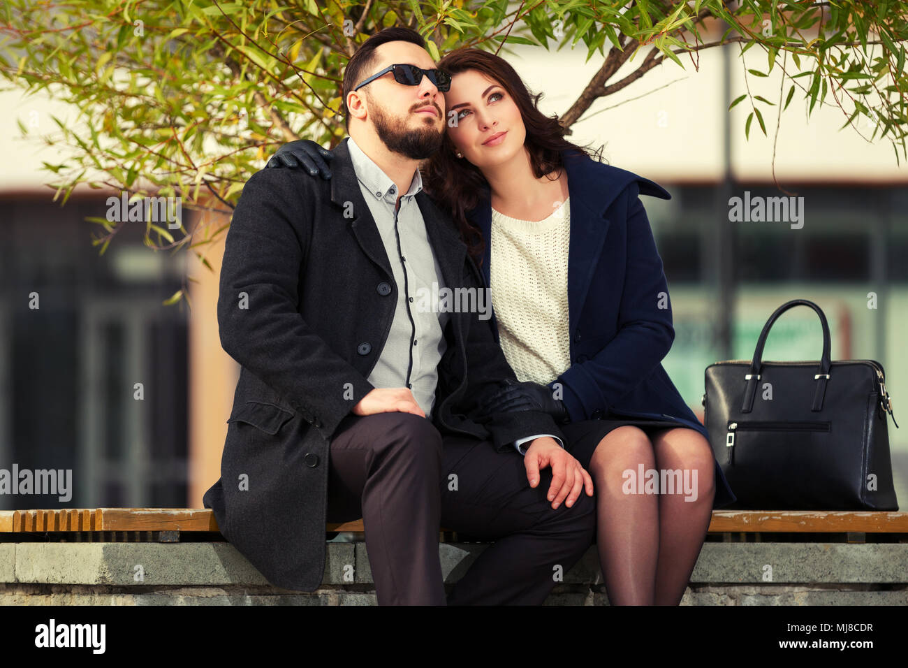 Young fashion couple in love on city street Stock Photo