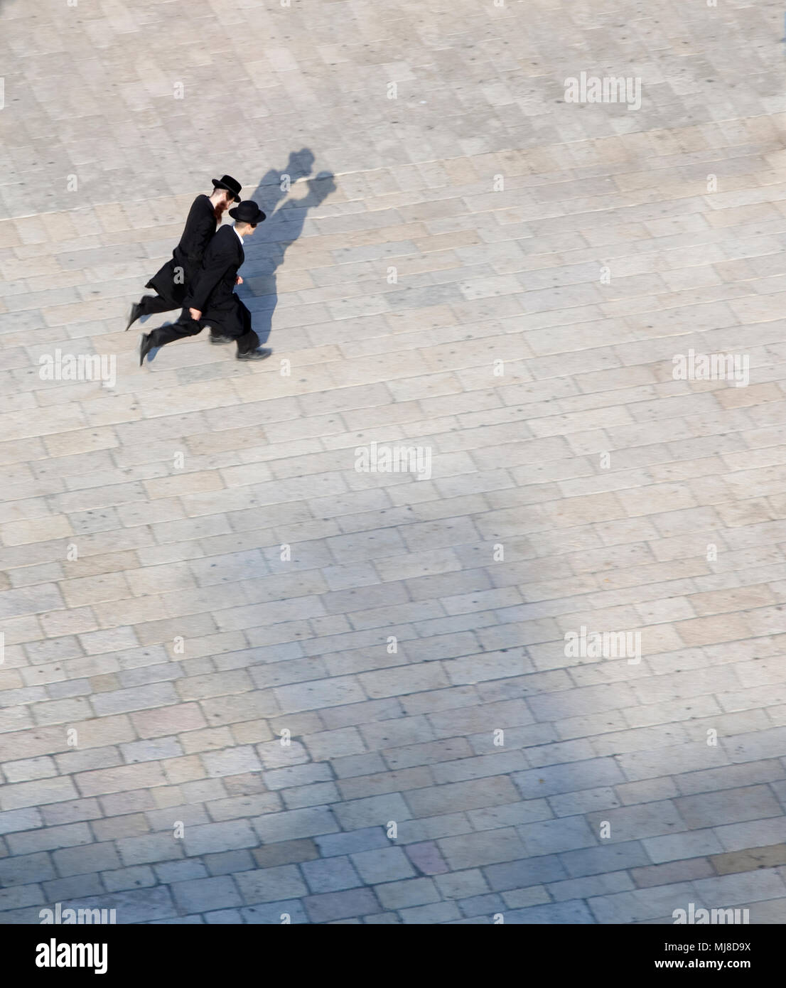 Men with black coats hi-res stock photography and images - Alamy