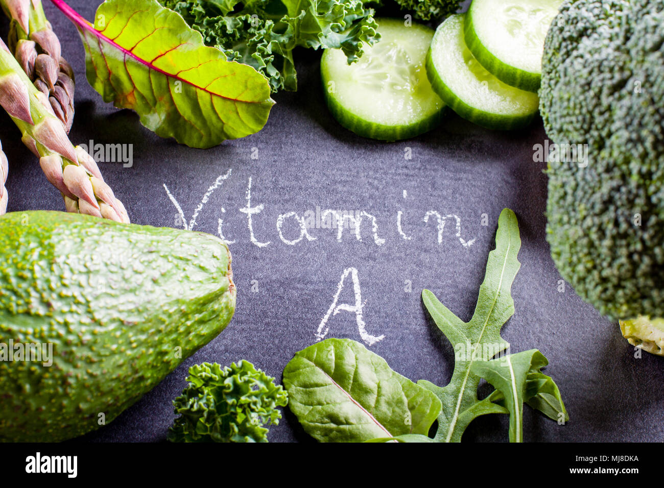 Green vegetables rich in vitamin A on black slate Stock Photo Alamy