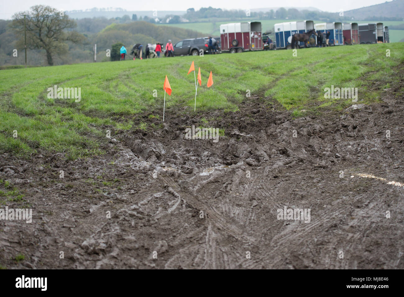 horse boxes in muddy field Stock Photo