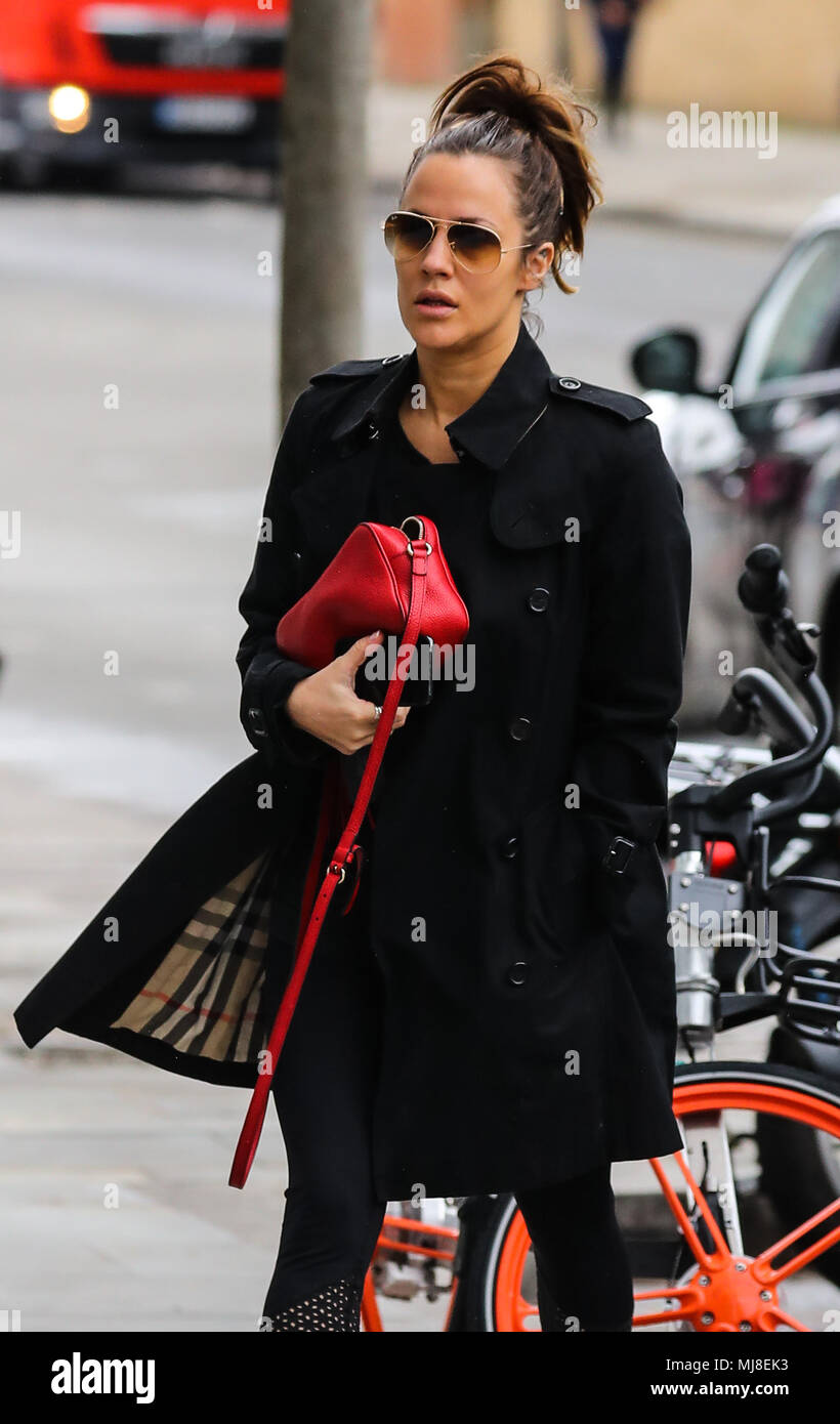 Caroline Flack heads to the gym wearing a Burberry raincoat and Ray-Ban  aviator sunglasses and carrying a Gucci handbag Featuring: Caroline Flack  Where: London, United Kingdom When: 03 Apr 2018 Credit: 