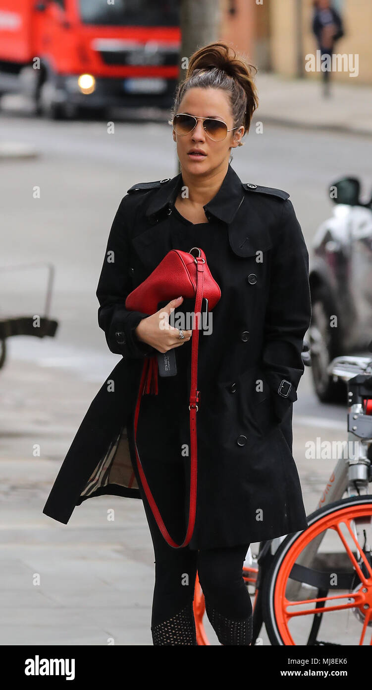Caroline Flack heads to the gym wearing a Burberry raincoat and Ray-Ban  aviator sunglasses and carrying a Gucci handbag Featuring: Caroline Flack  Where: London, United Kingdom When: 03 Apr 2018 Credit: 