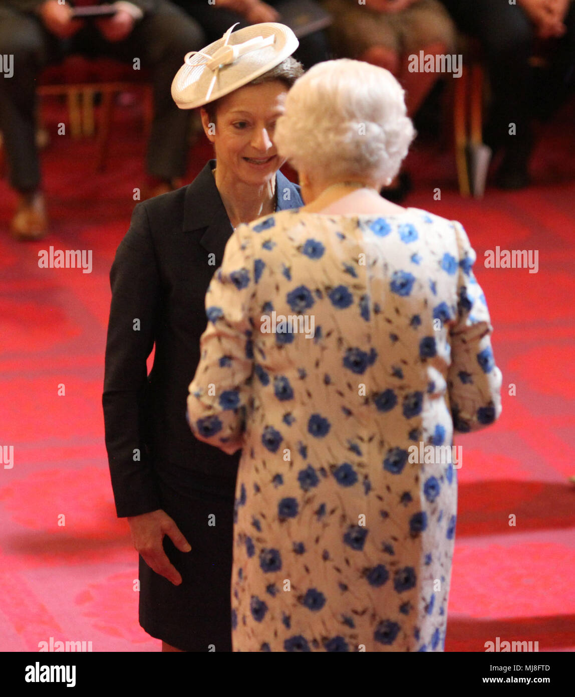 Former alpine skier Sarah Lewis is made an OBE (Officer of the Order of the British Empire) by Queen Elizabeth II during an investiture ceremony at Buckingham Palace, London. Stock Photo