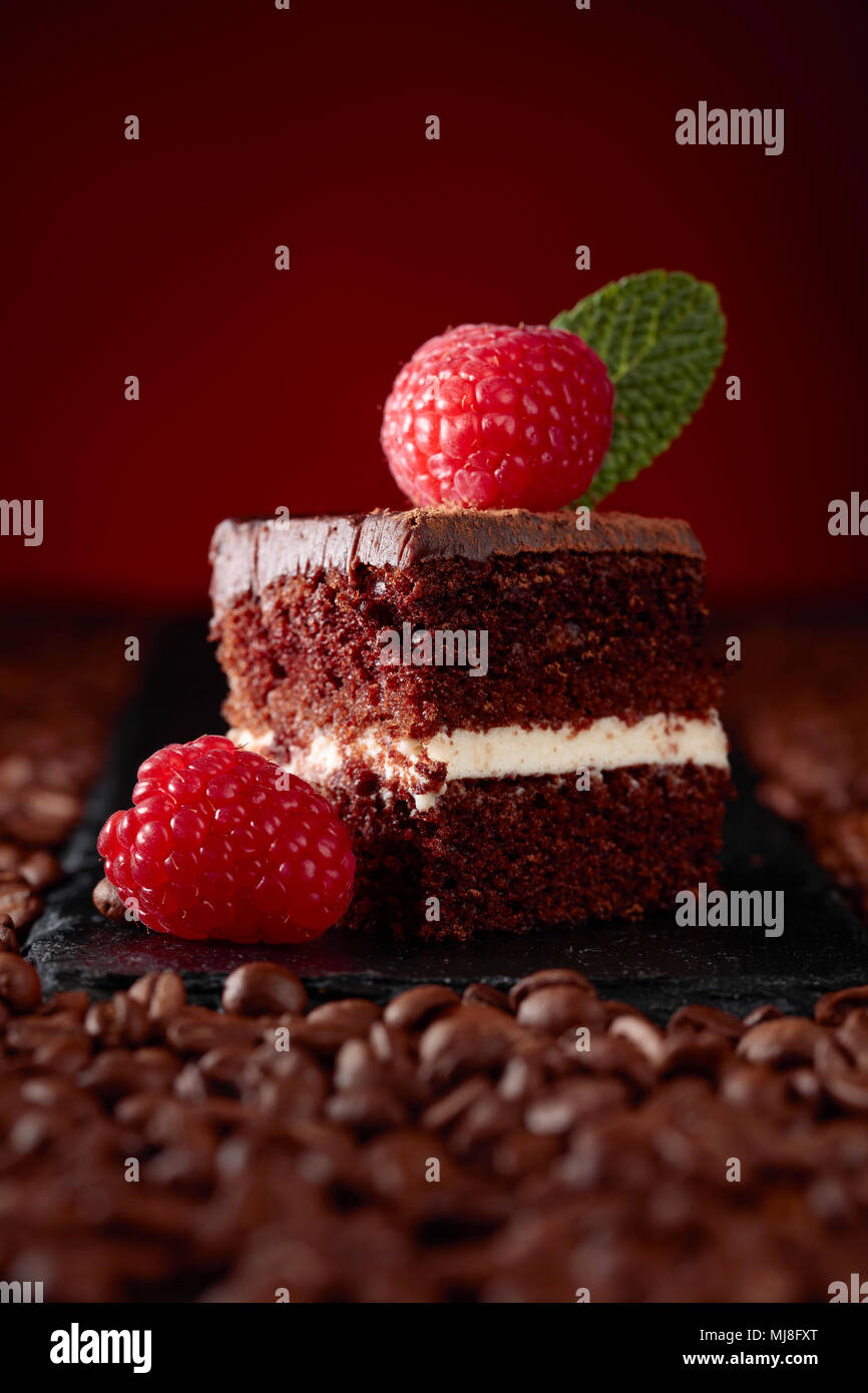 Closeup of chocolate cake with raspberry and mint Stock Photo - Alamy