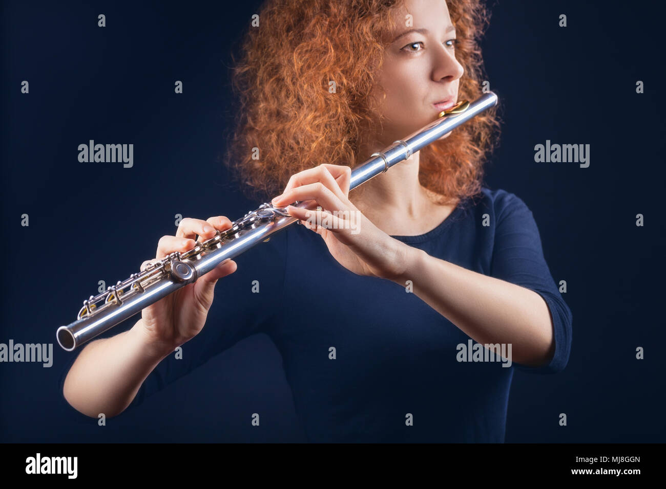 Young woman playing flute hires stock photography and images Alamy