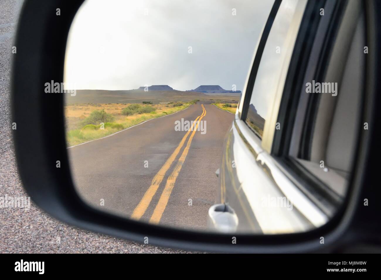 Nature Painted Desert in Arizona seen from the rearview mirror of a car ...