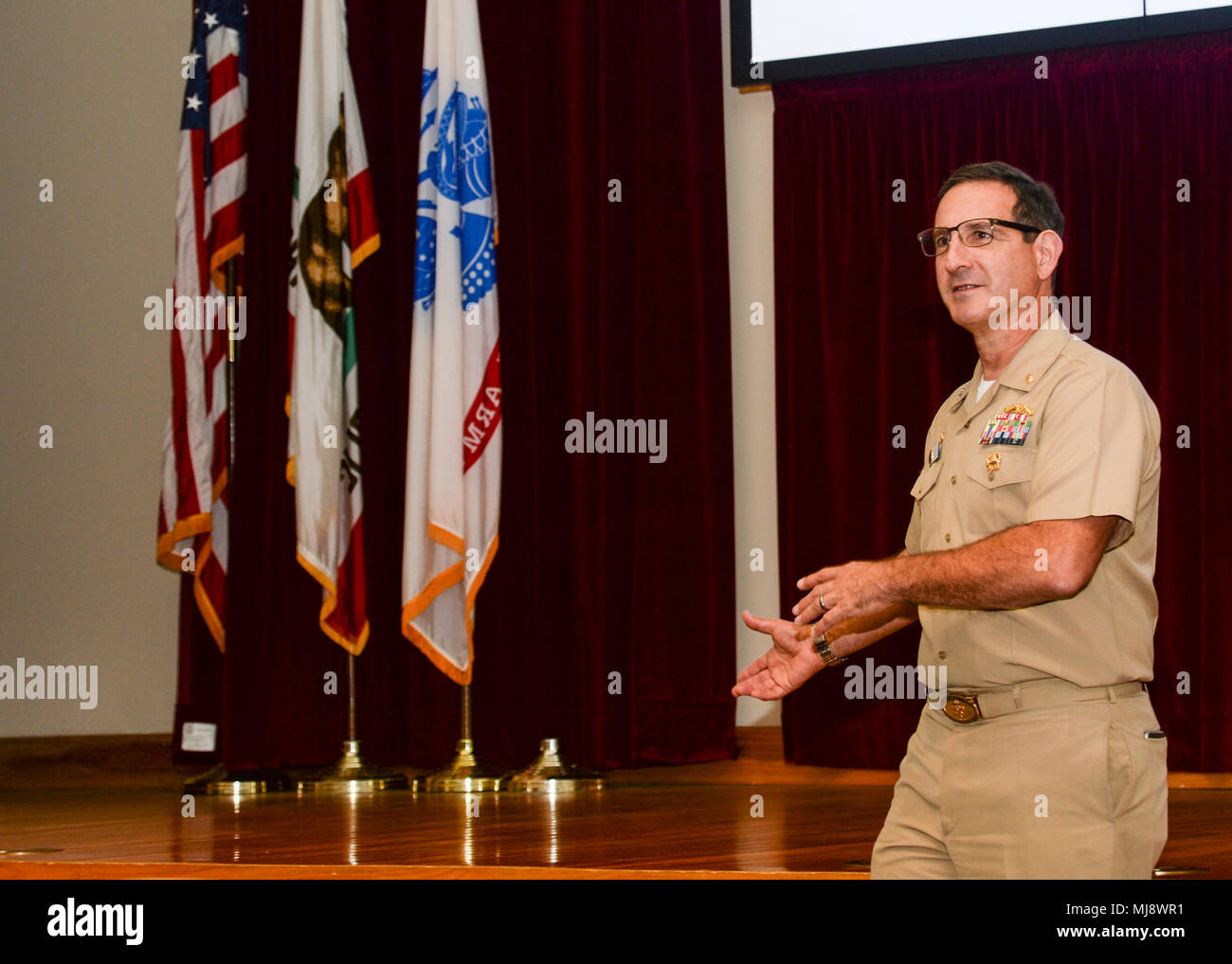 180420-N-PN275-1005 SAN DIEGO (April 20, 2018)  Capt. Joel Roos, commanding officer of Naval Medical Center San Diego (NMCSD) makes opening remarks at the 33rd annual Academic Research Competition. The competition lets residents and doctors to competitively showcase their research with speeches and board displays. (U.S. Navy Photo by Mass Communication Specialist 2nd Class Zachary Kreitzer) Stock Photo