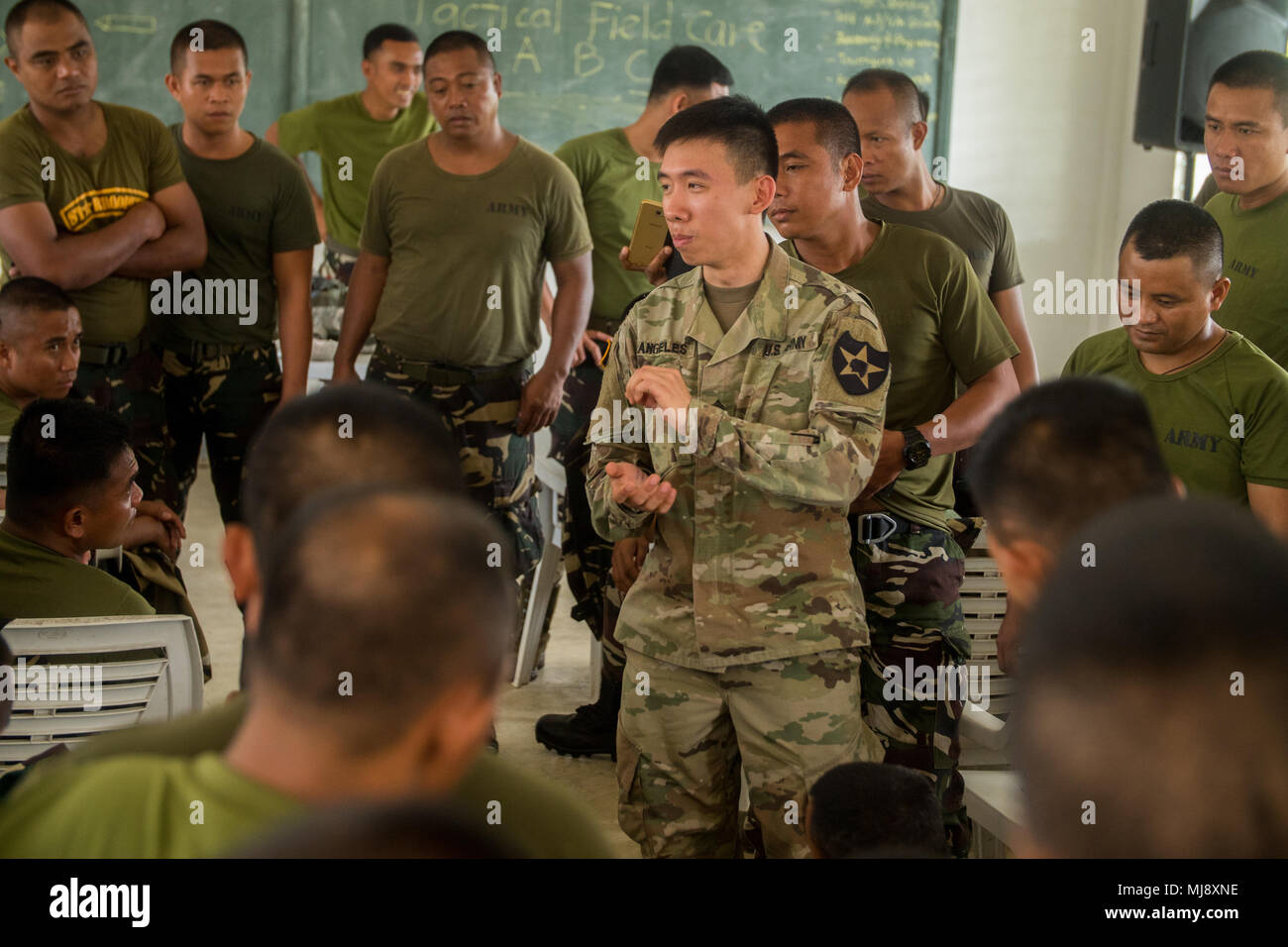 U.S. Army Sgt. John Angeles, combat medic, Charlie Company, 2nd Brigade  Support Battalion, 2-2 Stryker Brigade Combat Team, 2nd Infantry Division,  and Philippine Army soldiers with 95th Infantry Battalion, 5th Infantry  Division