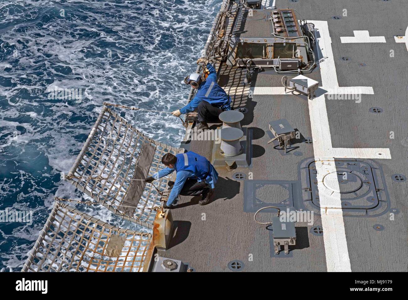 180422NNB1781020 ATLANTIC OCEAN (April 22, 2018) Sailors lower flight deck in