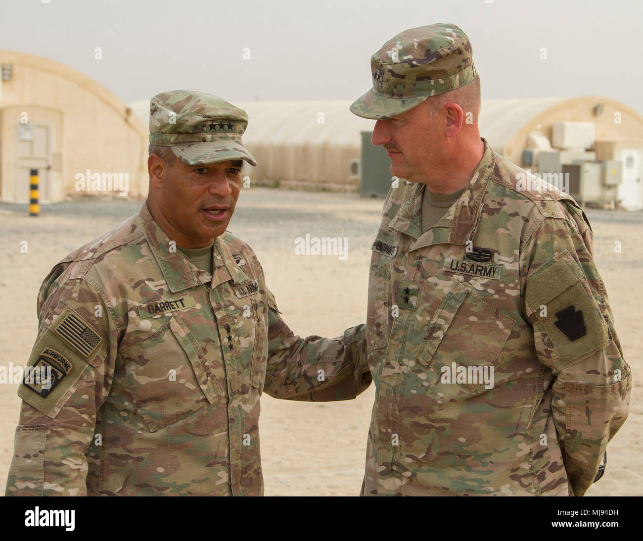 Lt. Gen. Michael X. Garrett, U.S. Army Central commander, and Maj. Gen. Andrew P. Schafer, 28th Infantry Division commander, have a conversation following a brief visit to their headquarters at Camp Arifjan, Kuwait, April 22, 2018. (U.S. Army photo by Spc. Joshua P. Morris, USARCENT PAO) Stock Photo