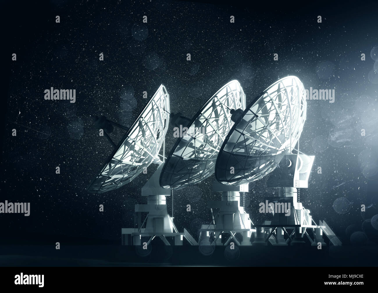 A group of large radio telescopes at night. 3D illustration Stock Photo