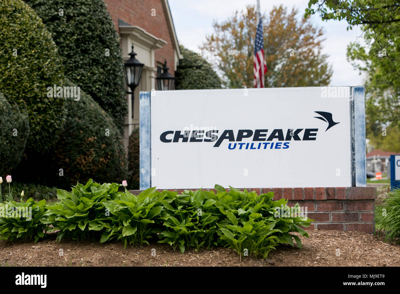 A logo sign outside of a facility occupied by the Chesapeake Utilities Corporation in Dover, Delaware on April 29, 2018. Stock Photo