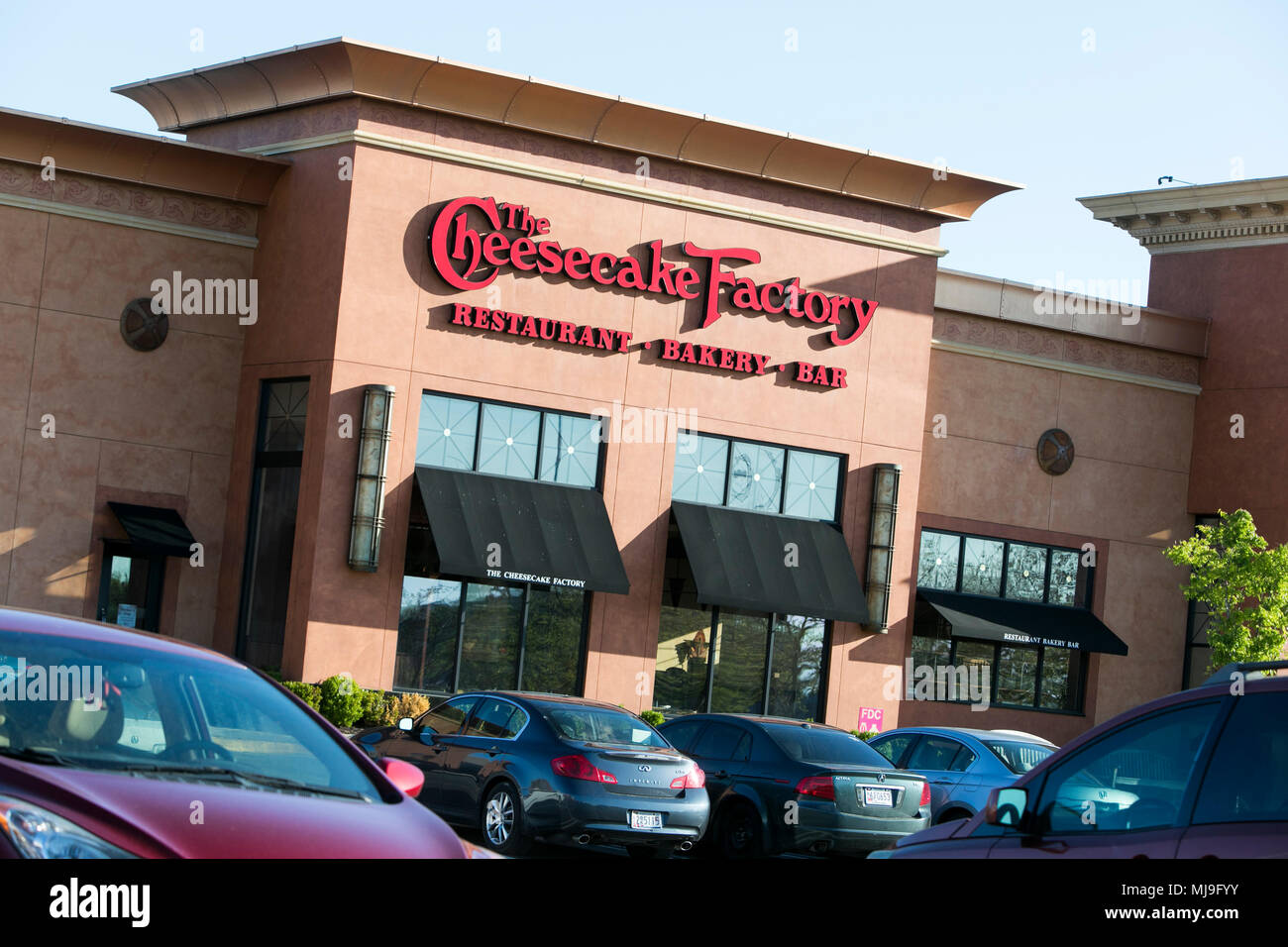 A logo sign outside of a Cheesecake Factory restaurant location in Annapolis, Maryland on April