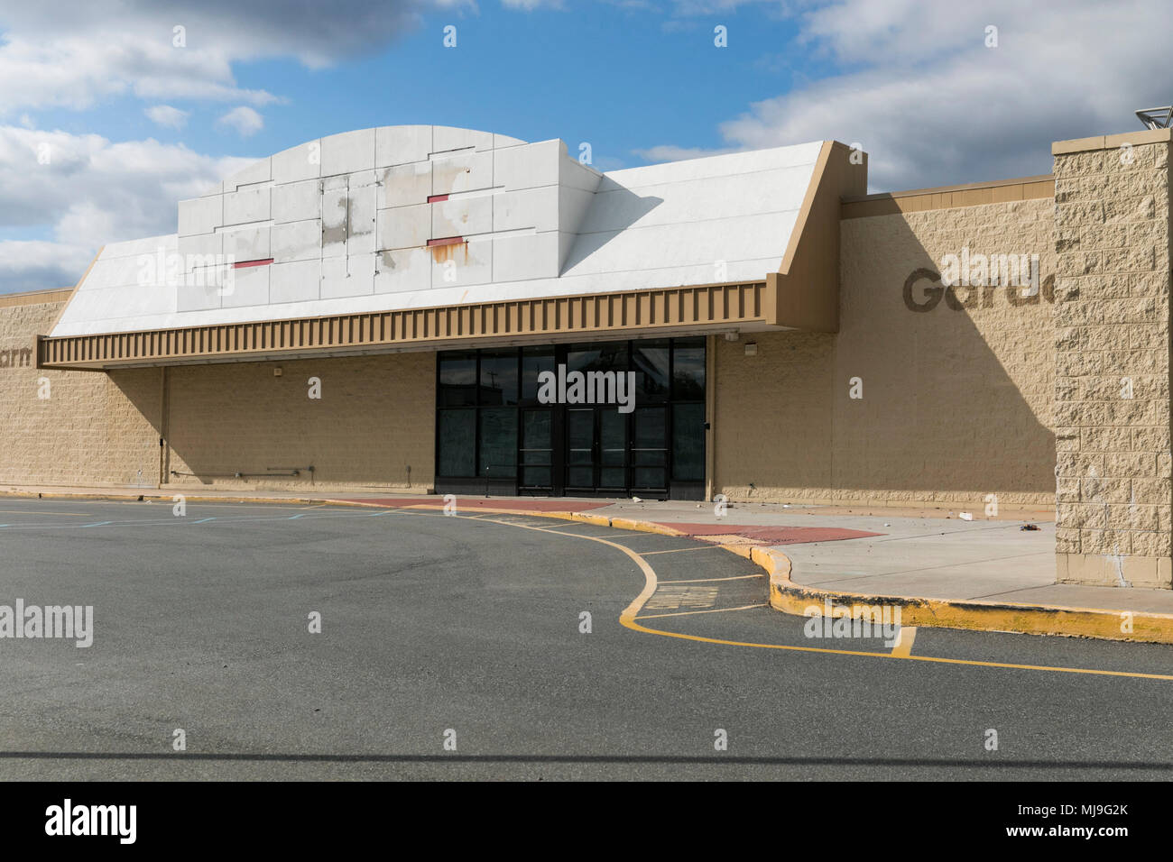 The outline of a logo sign at a now closed Big Kmart retail store in