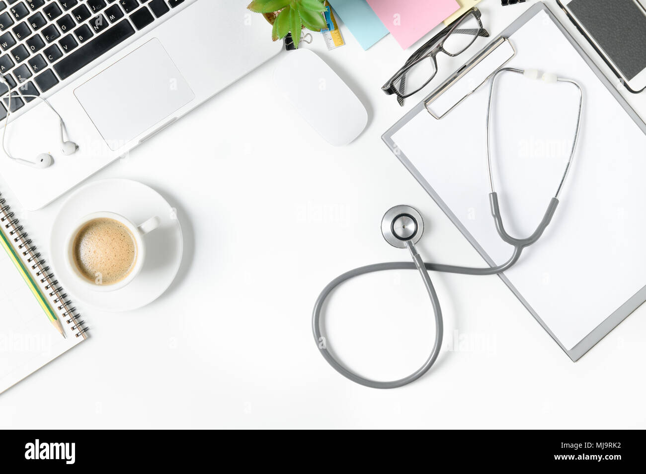 Top view of doctor desk table with stethoscope, coffee and blank paper ...