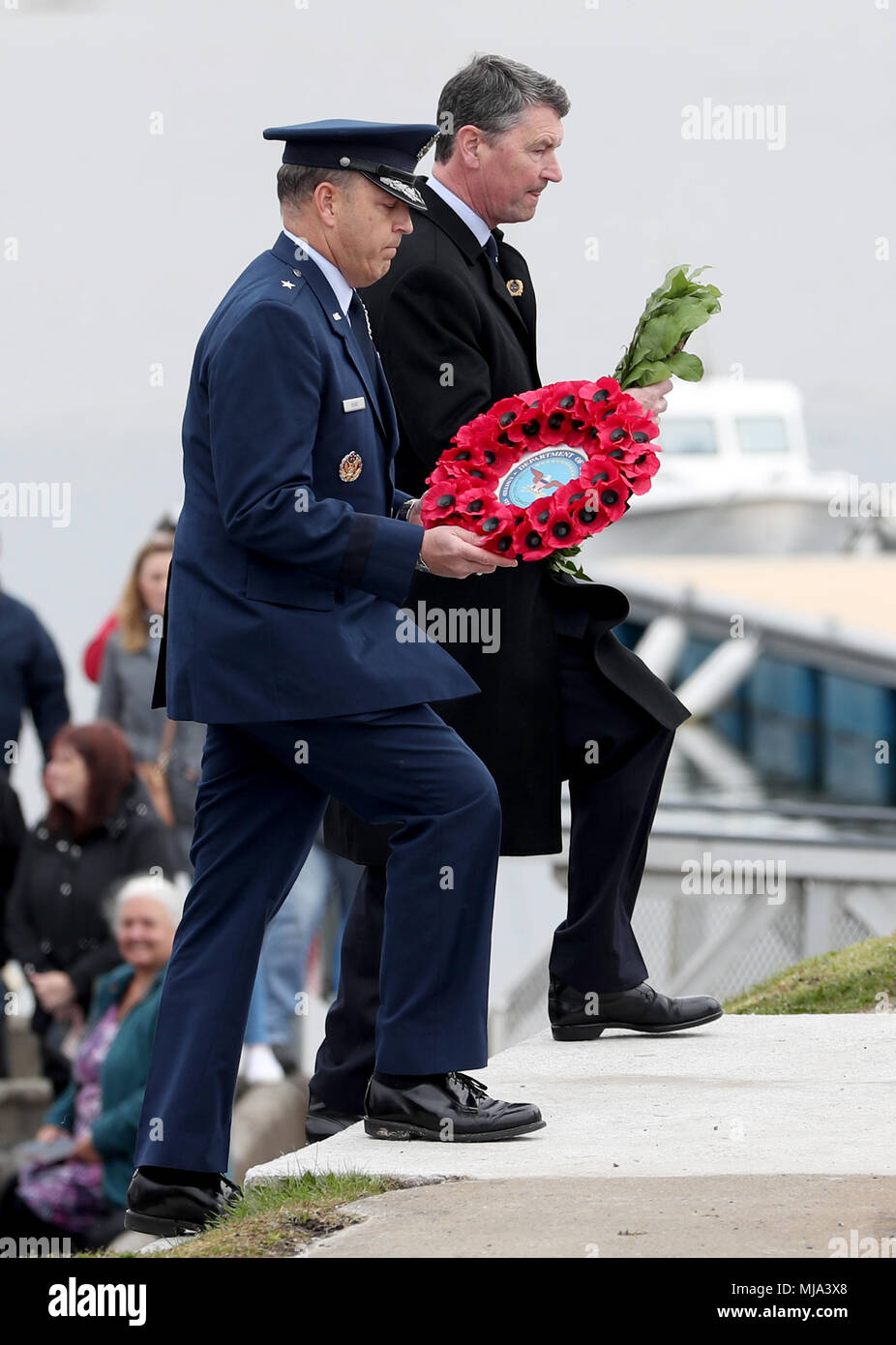 US Air Force Brigadier General Christopher Short and Vice Admiral Sir Timothy Laurence (right), lay wreathes during a commemoration service at the War Memorial in Port Ellen, Islay, for around 700 First World War soldiers who lost their lives following the sinking of the SS Tuscania and HMS Otranto within eight months of each other in 1918 off of the coast of the small Scottish island. Stock Photo