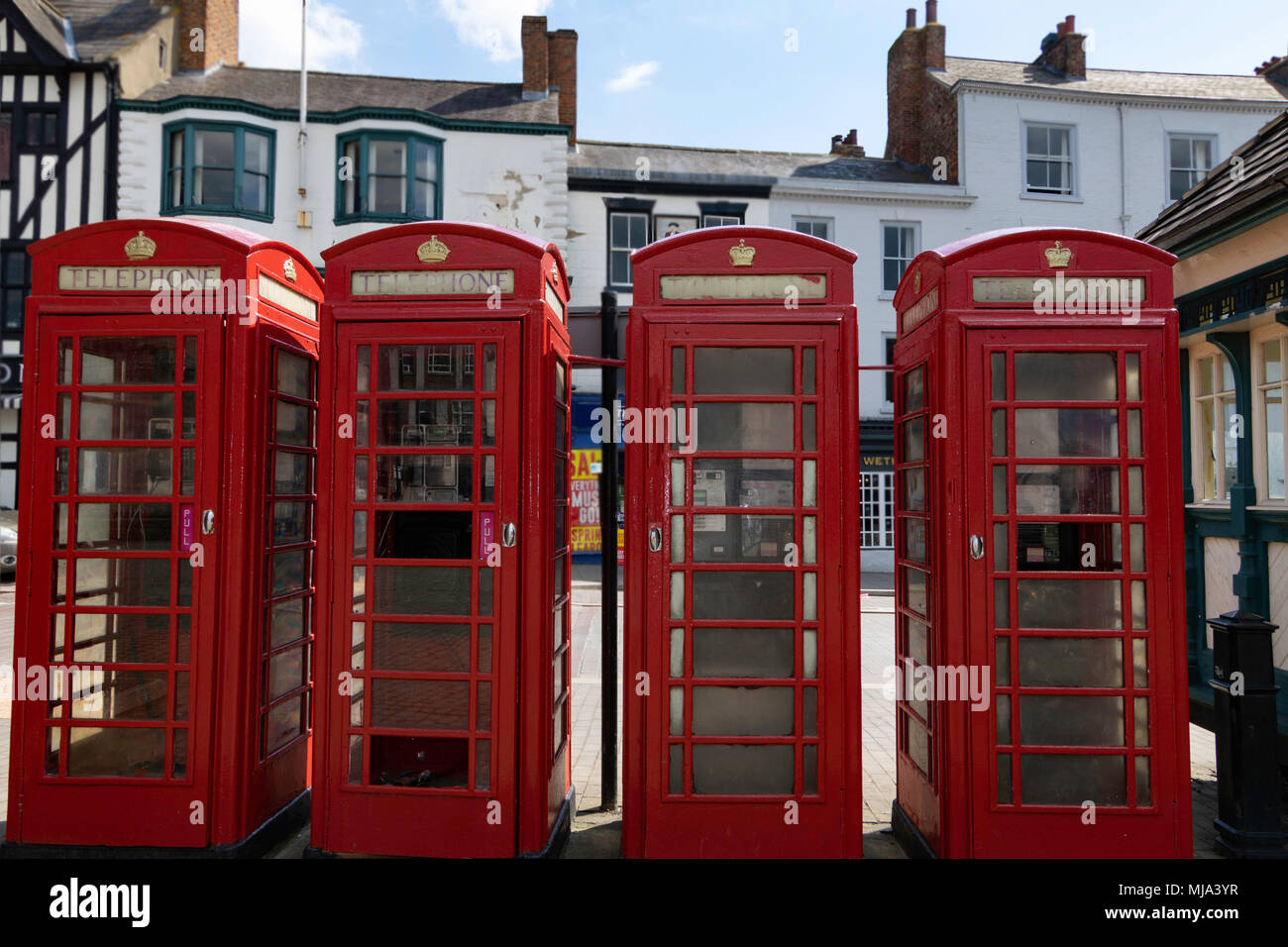 Four Red Telephone Boxes in The Market Square at Ripon, North Yorkshire, England, UK. Stock Photo