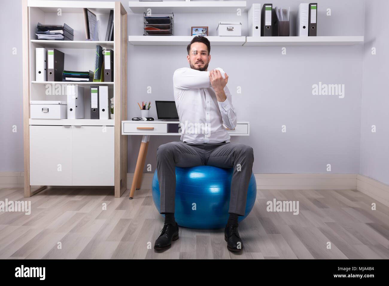 yoga-ball-desk-man-hi-res-stock-photography-and-images-alamy