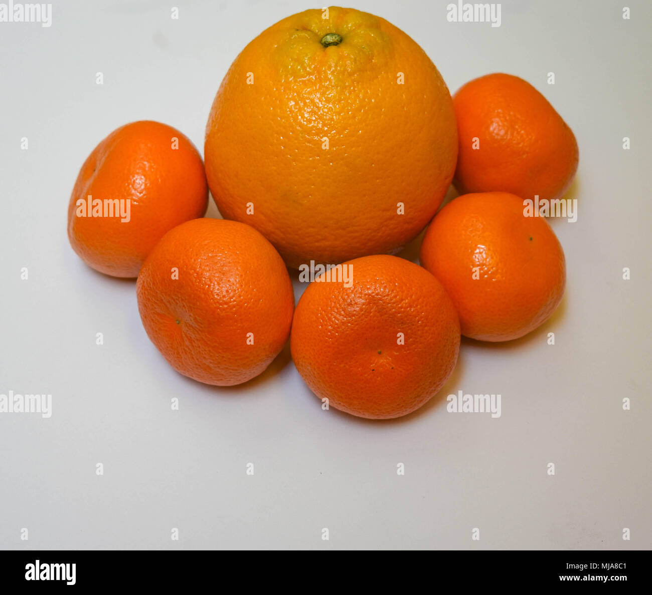 Mandarins and an Orange Stock Photo Alamy