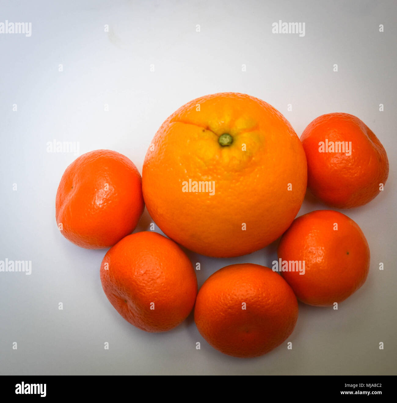 Mandarins and an Orange Stock Photo Alamy