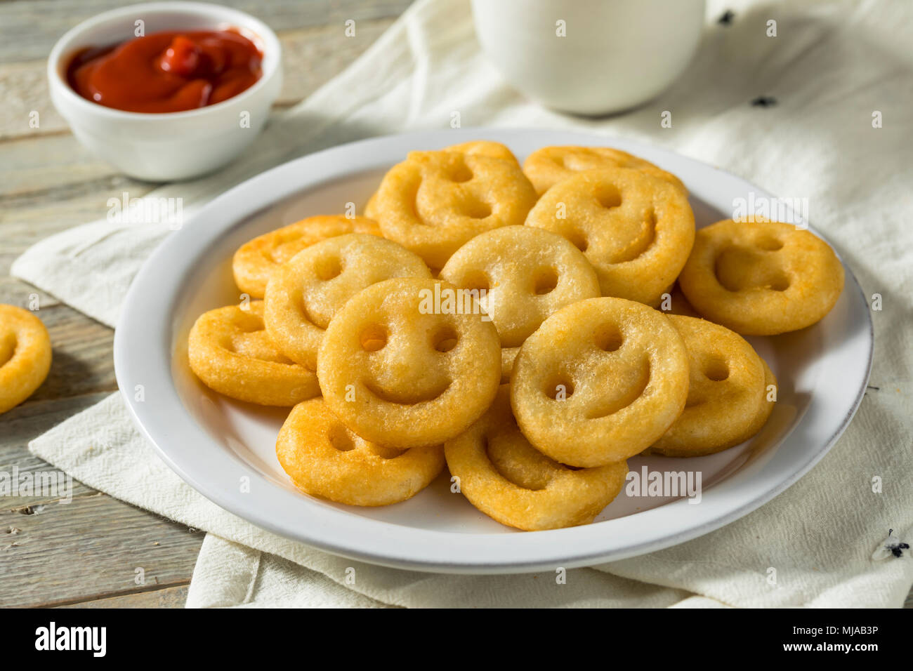 Homemade Smiley Face French Fries with Ketchup Stock Photo