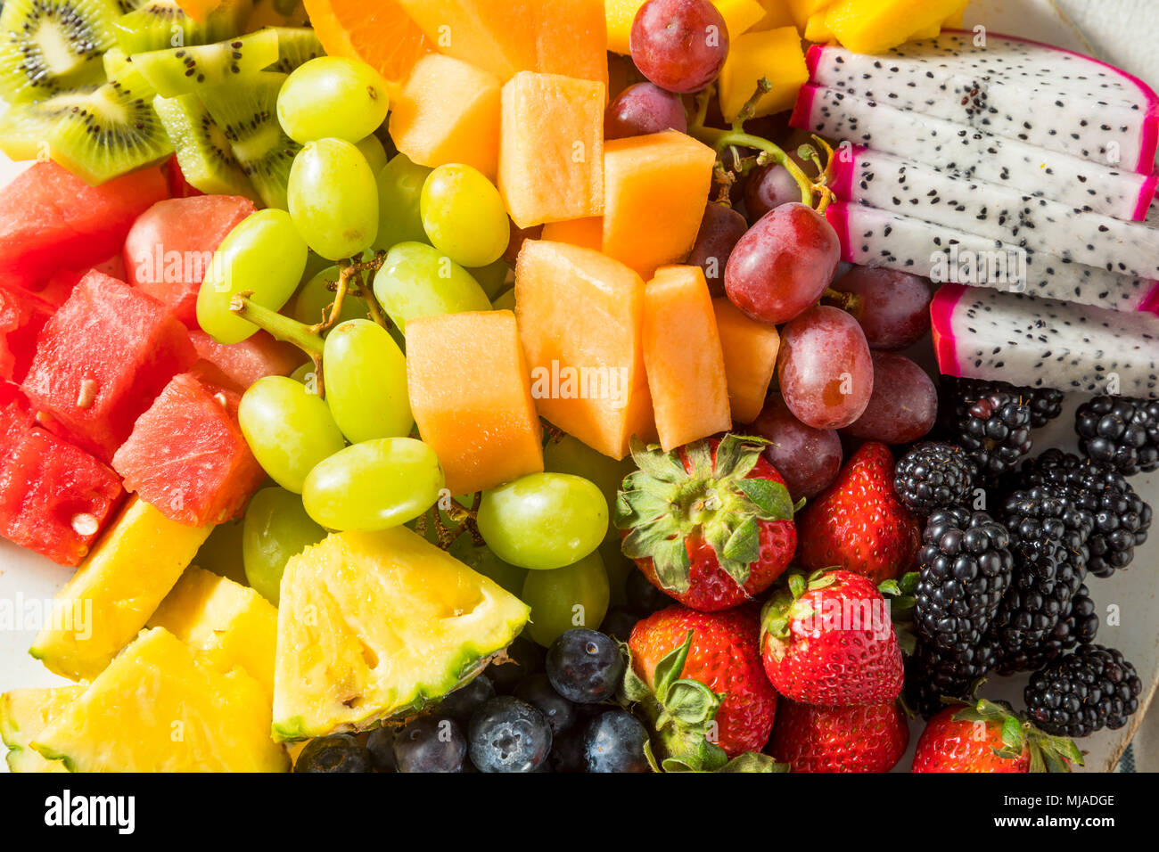 Raw Organic Fruit Platter with Berries Melons and Grapes Stock Photo Alamy