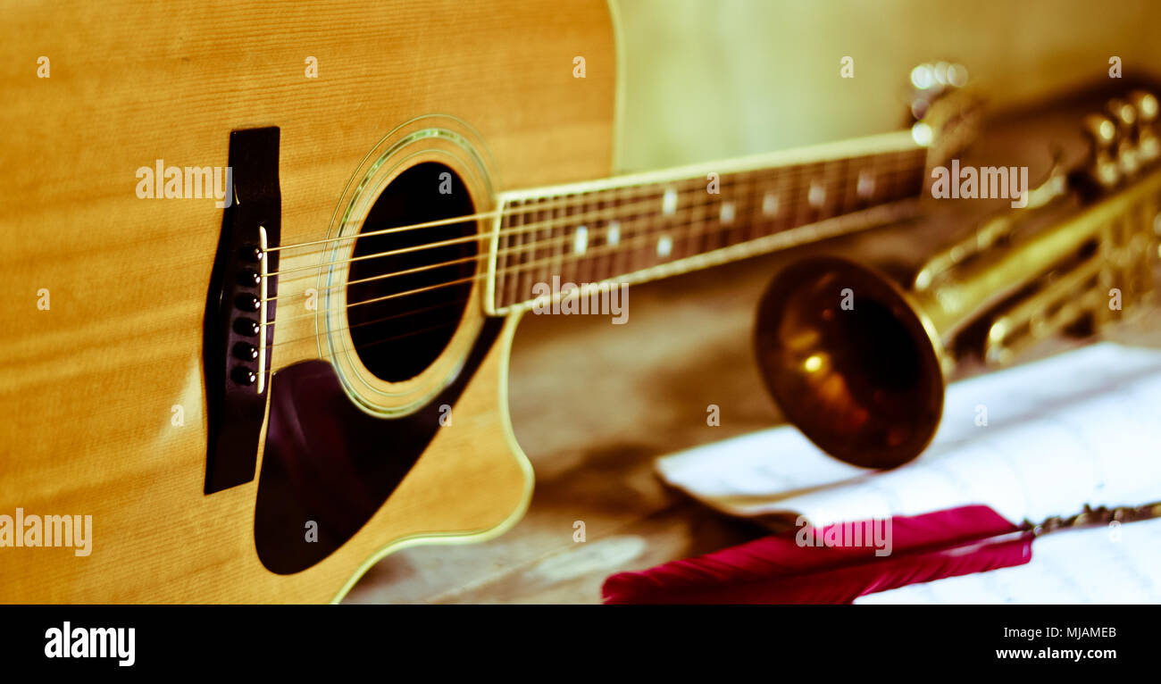 A guitar a trumpet and musical notes Stock Photo Alamy