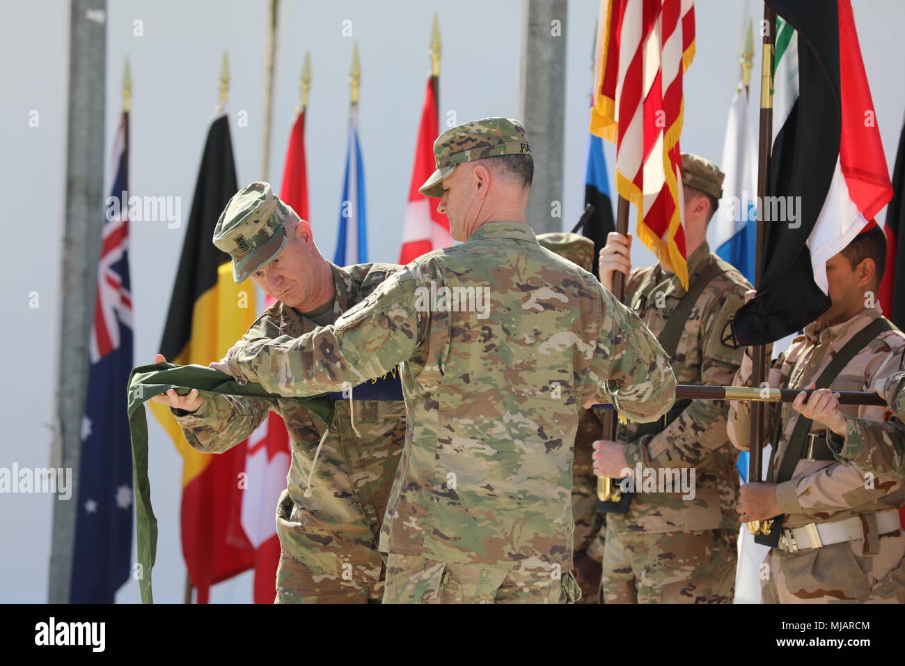 Maj. Gen. Walter Piatt, right, commander of Combined Joint Forces Land