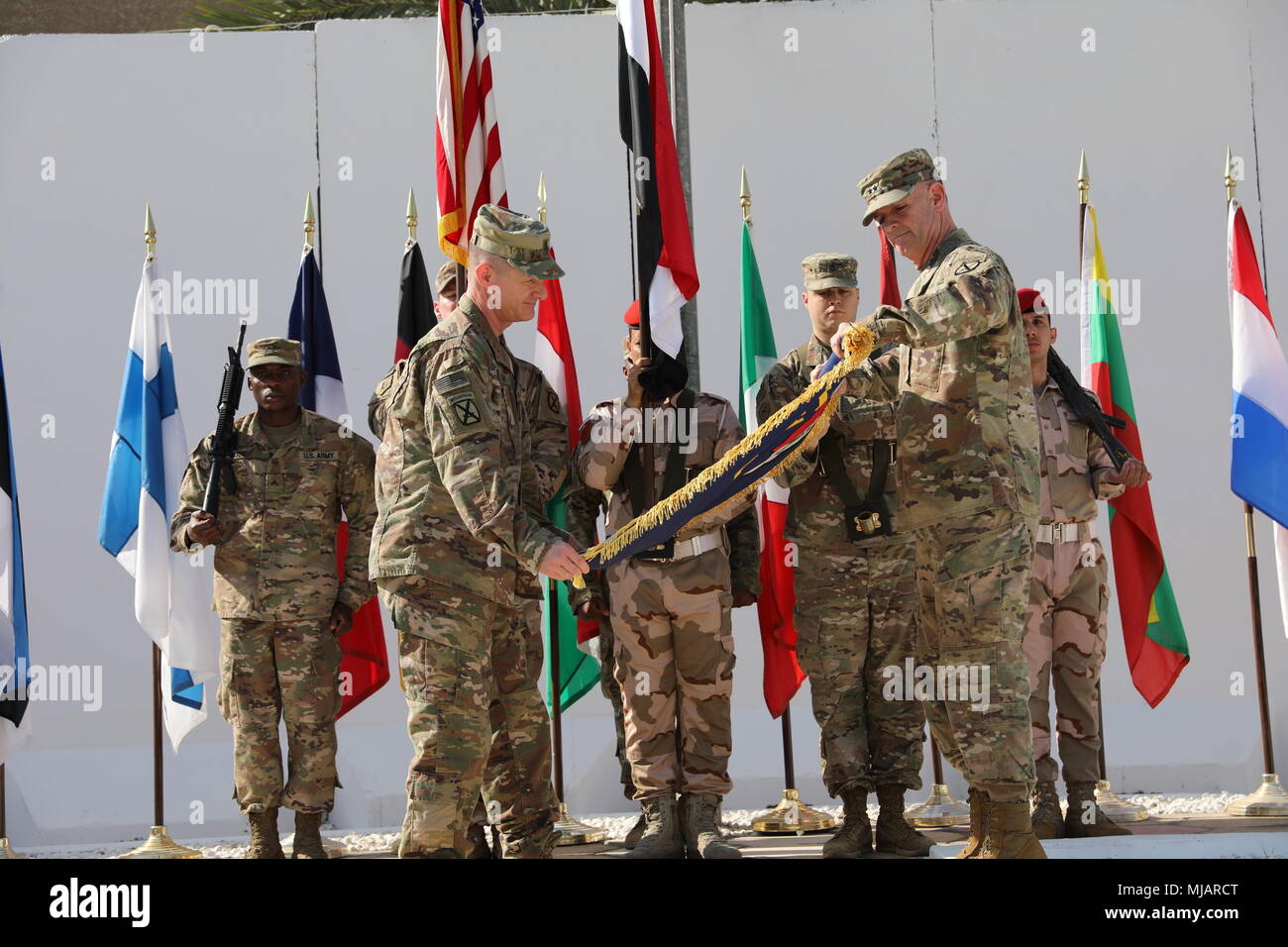 Maj. Gen. Walter Piatt, right, commander of Combined Joint Forces Land