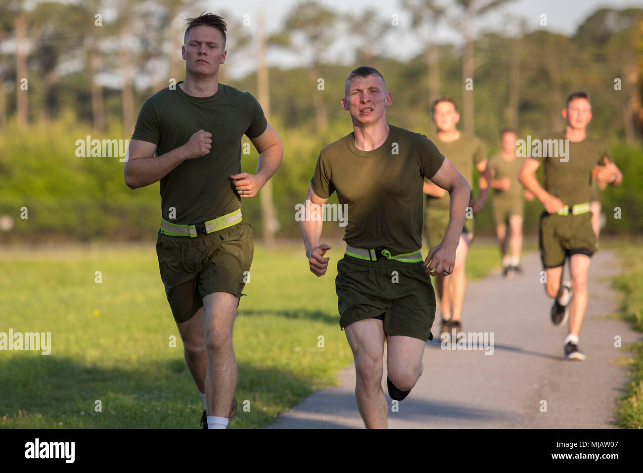 Marines conduct the run portion of the Physical Fitness Test aboard Marine  Corps Air Station Beaufort April 27. The PFT is an annual requirement for  all Marines, and consists of Pull-ups, crunches,