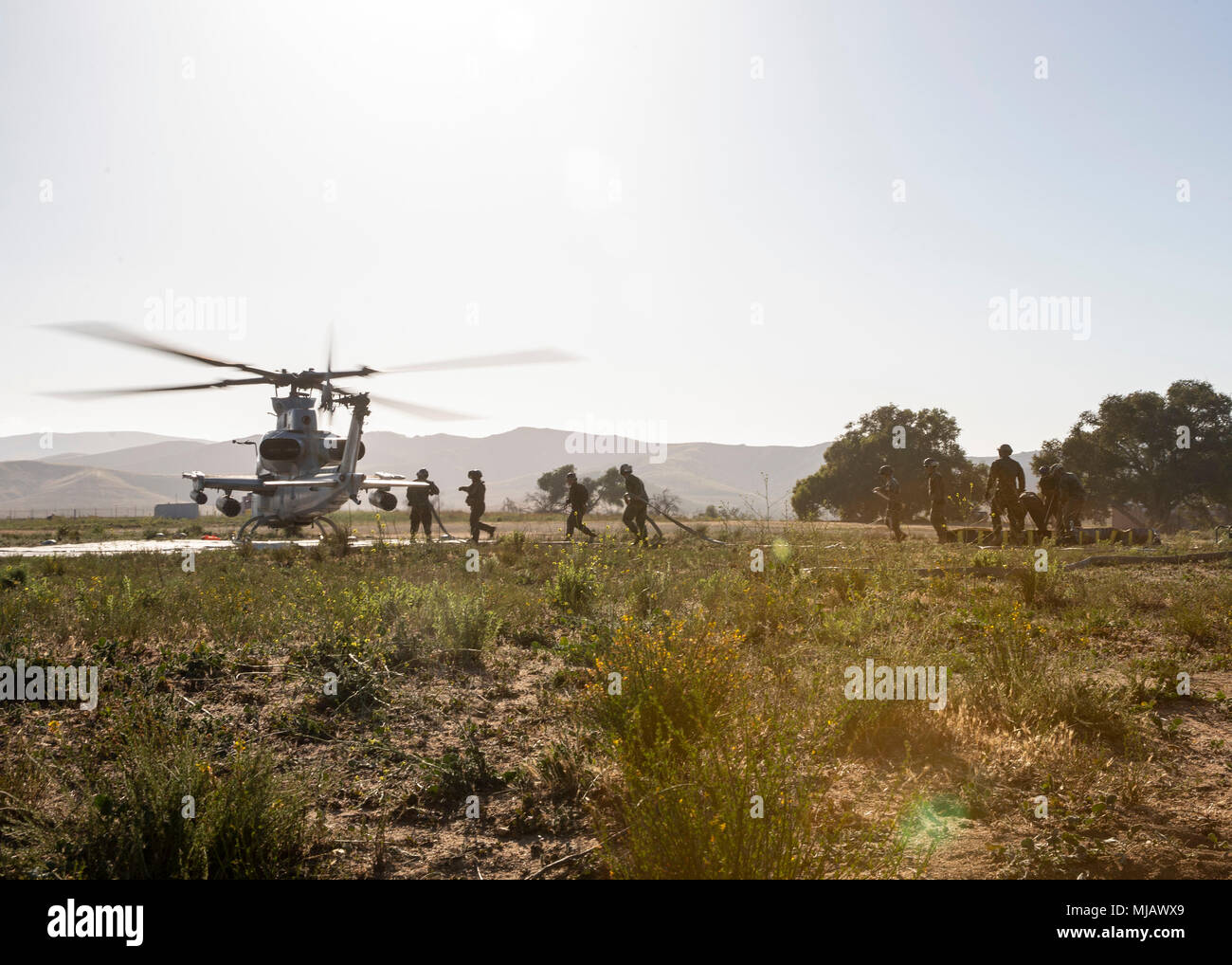 Marine Wing Support Squadron 372 personnel refuel an AH-1Z Viper ...