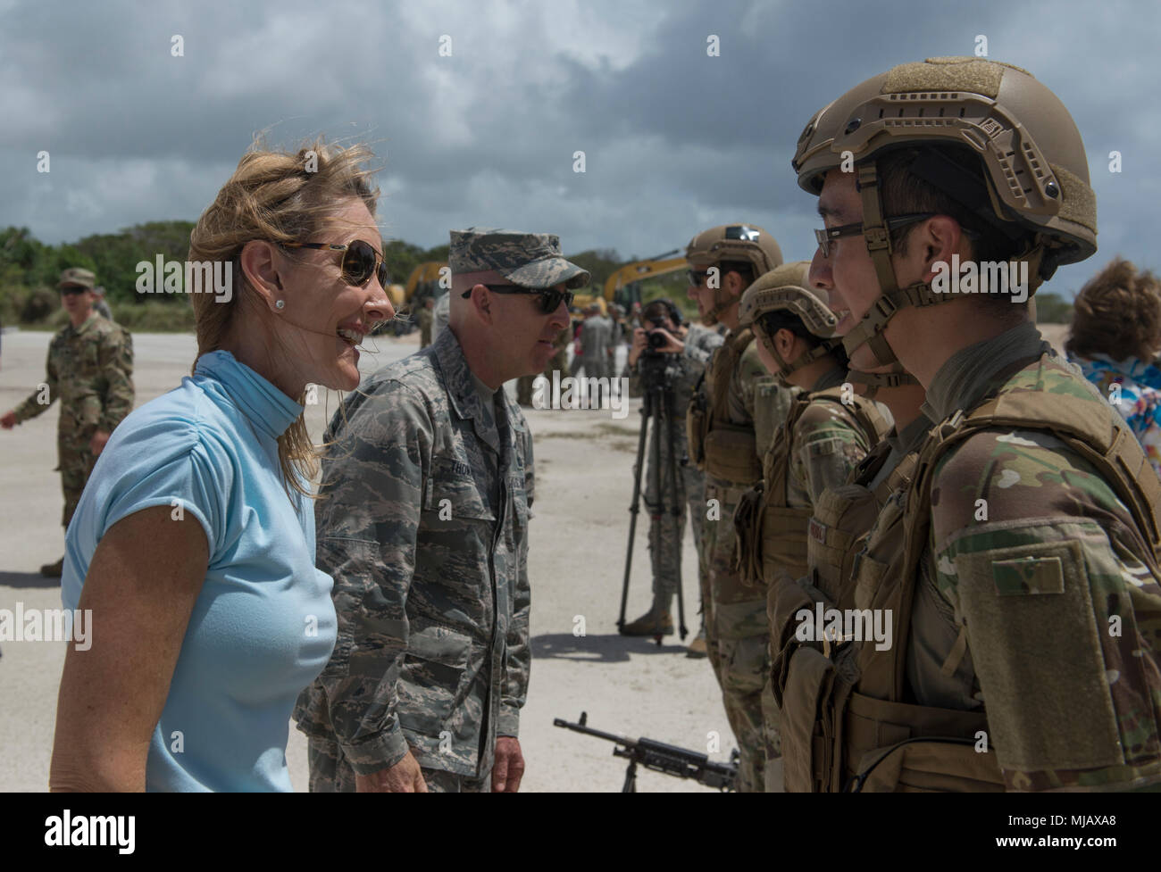 Ms. Karrin Taylor, Air Force civic leader, left, and Brig. Gen. Edward Thomas, director of Public Affairs, office of the secretary of the Air Force, speak to Airmen assigned to the 736th Security Forces Squadron during a civic leader tour visit to Andersen Air Force Base, Guam, April 28, 2018. The tour allowed the civic leaders to view a new perspective of the military missions on island by getting a behind-the- scenes look into workcenters and flightline operations. (U.S. Air Force photo by Staff Sgt. Alexander W. Riedel) Stock Photo