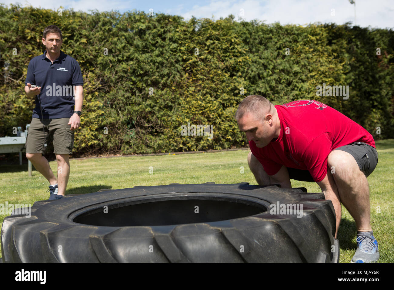 U.S. Air Force Major Joseph Clark participates in a tire flipping
