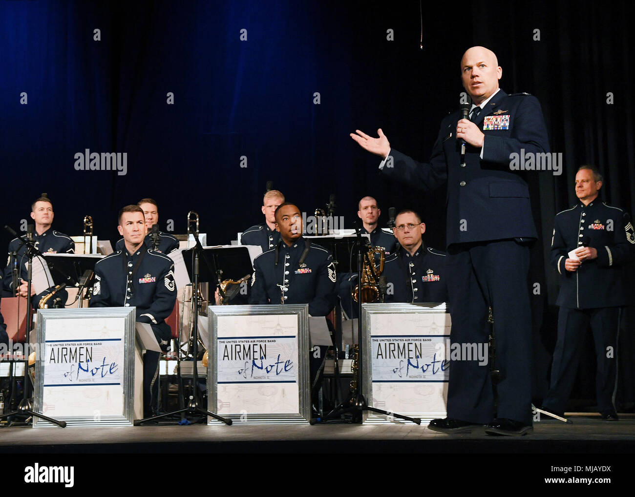 Col. Roman Hund, installation commander, welcomes the U.S. Air Force Band  Airmen of Note to the area during a performance in Gloucester, Mass., April  23. The performance was part of the band's