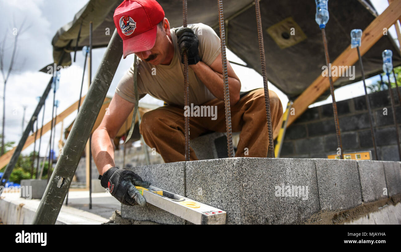 U.S. Air Force Staff Sgt. Jason Moldenhauer, 346th Air Expeditionary Group Rapid Engineer Deployable Heavy Operational Repair Squadron Engineer member who is deployed from Nellis Air Force Base, Nev., ensures a wall is level April 27, 2018 at a construction site in Meteti, Panama. Moldenhauer is participating in Exercise New Horizons 2018, which is a joint training exercise where U.S. military members conduct training in civil engineer, medical, and support services while benefiting the local community. (U.S. Air Force photo by Senior Airman Dustin Mullen/Released) Stock Photo