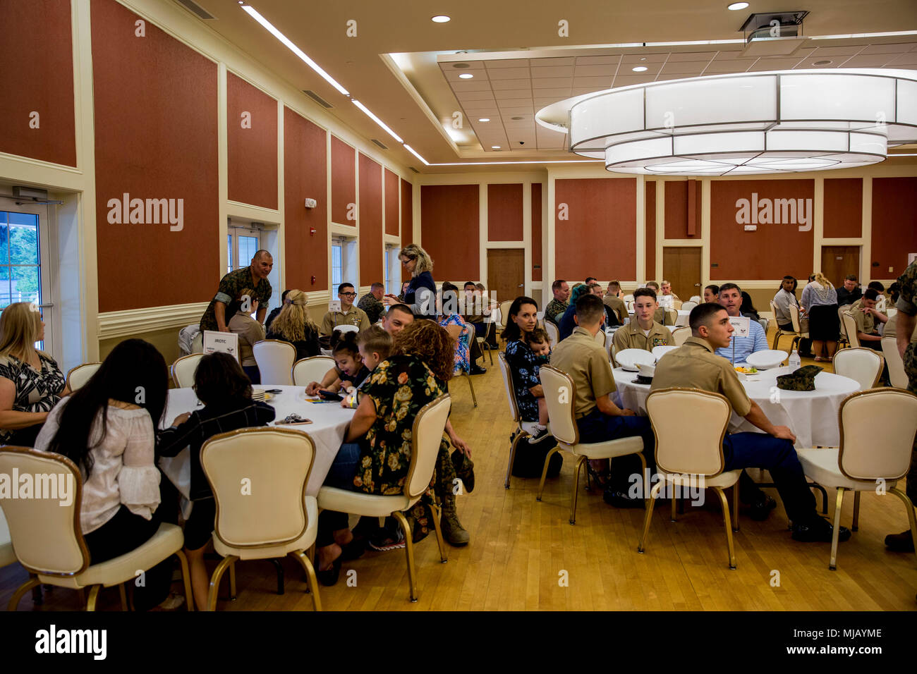 JROTC members from Lejeune High School and their family members take their seats before the
