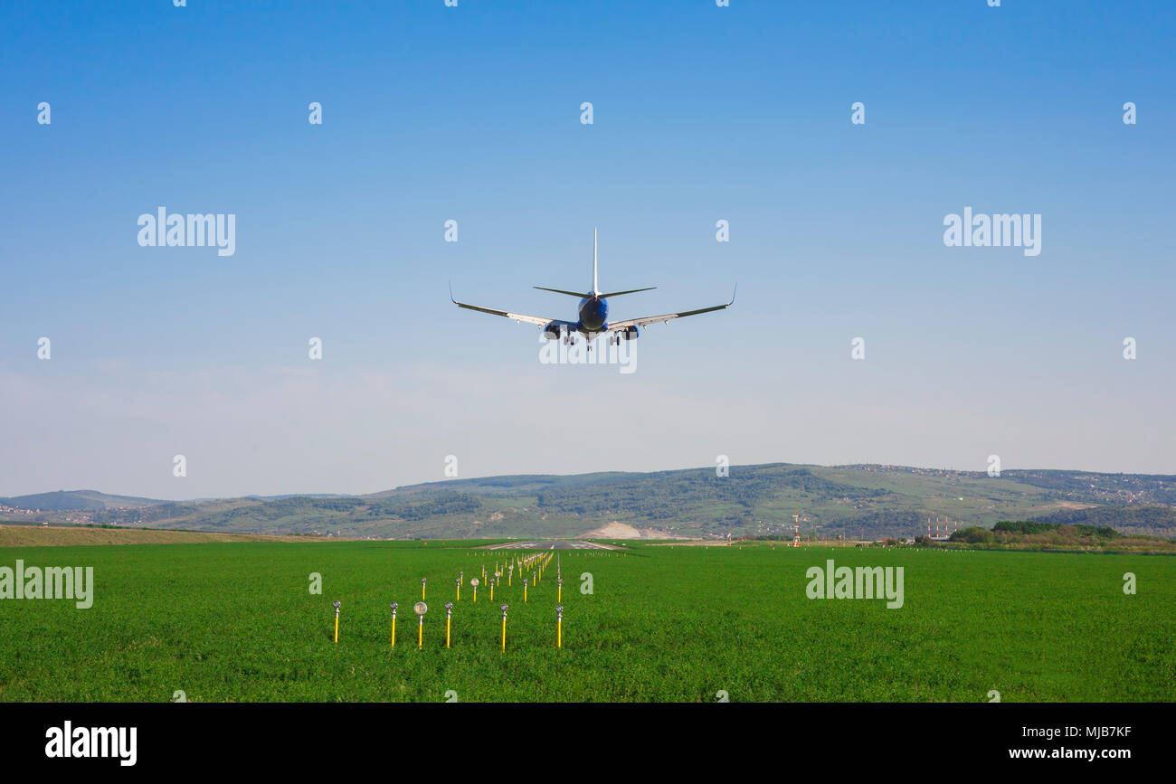 Airplane landing on airport runway hi-res stock photography and images ...