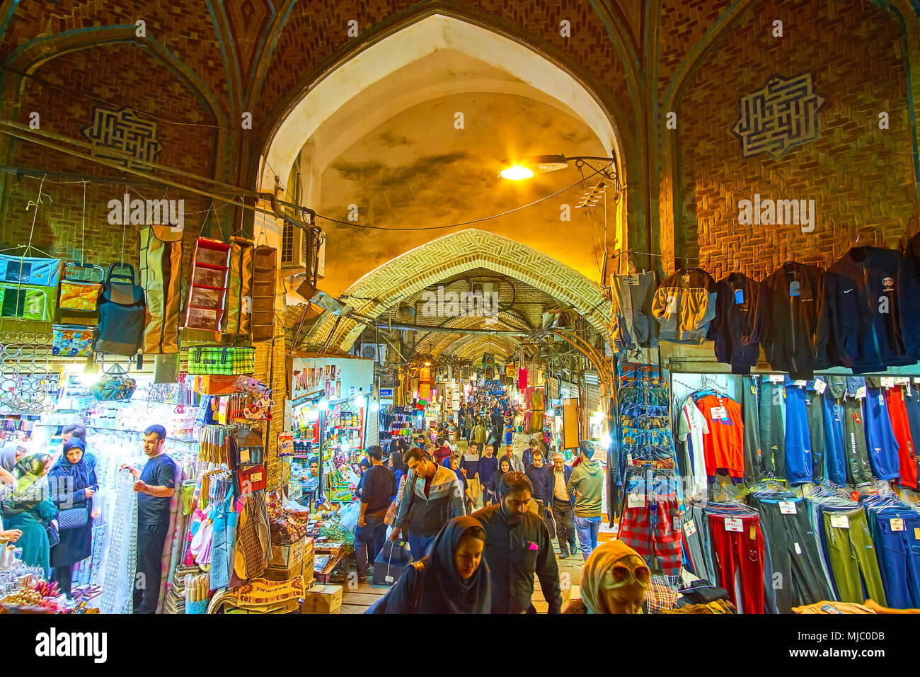 TEHRAN, IRAN - OCTOBER 25, 2017: Evening is the most busiest time in old Grand Bazaar, all stores are open and crowds of clients walk in archways of t Stock Photo