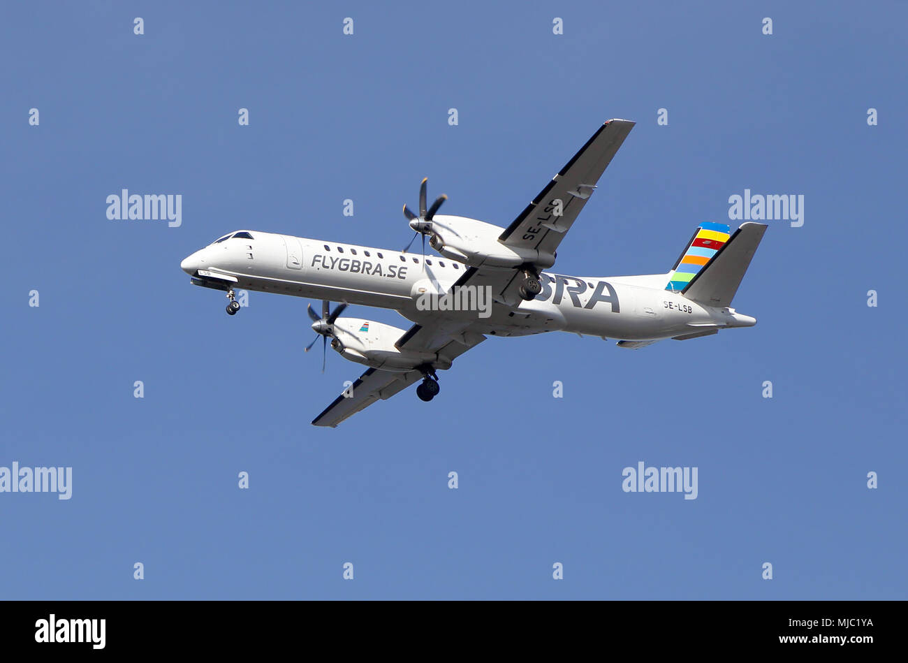 Stockholm, Sweden - May 3, 2016: Braathens Regional (SE-LSF) Saab 2000 during approach to Bromma airport against blue sky. Stock Photo