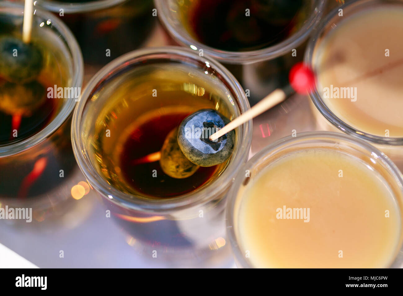 many ready alcoholic beverage. Shot cocktails stack with berry