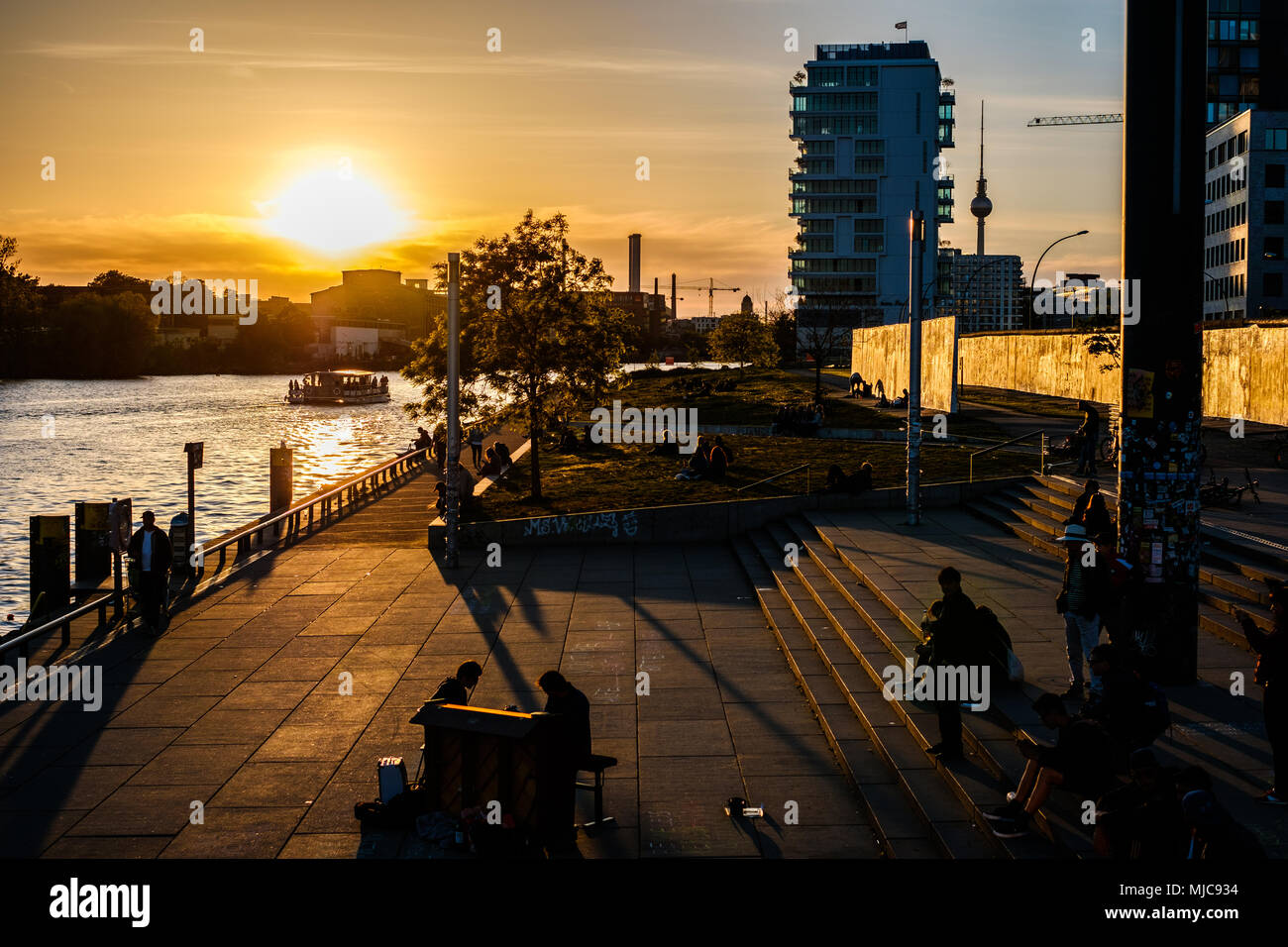 Berlin Riverside Berlin, Germany - may, 2018: People at riverside at Berlin Wall / East ...