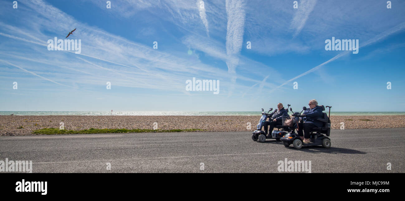 Mobility scooters on Worthing promenade, West Sussex, UK Stock Photo