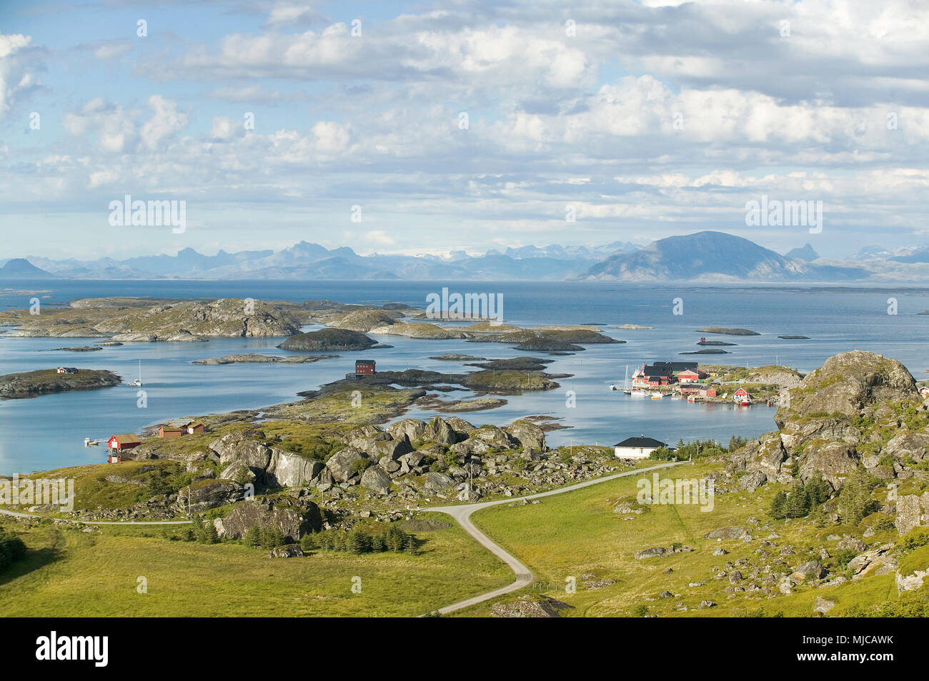 colorful wooden houses in midnight sun on the Island of Lovund in