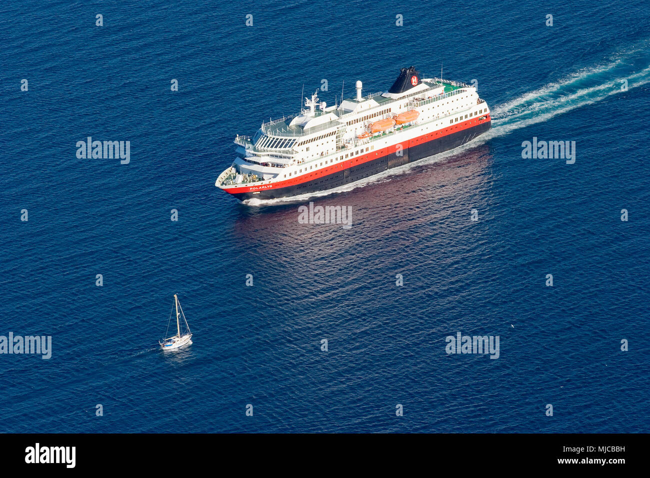 famos Hurtigrouten post ship underway to North cape in norwegian waters Stock Photo