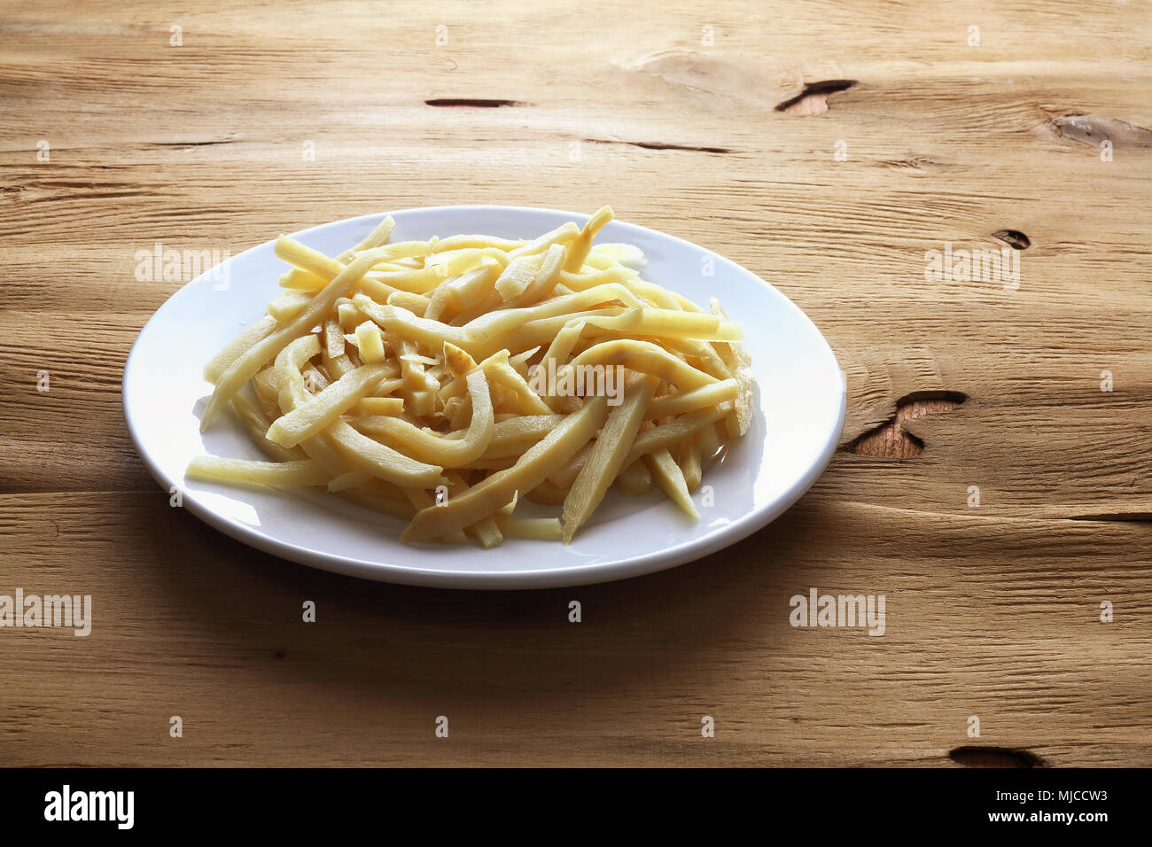 Bamboo Shoots on Wooden Background Stock Photo