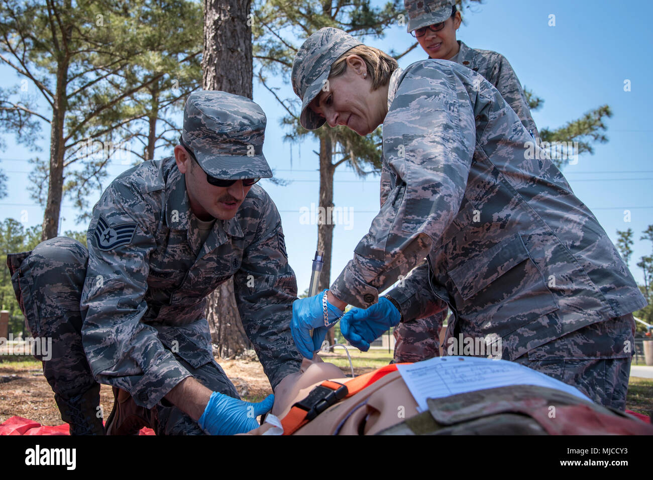 Col. Jennifer Short, right, 23d Wing commander, inserts a intubation tube into the mouth of a mannequin, April 30, 2018, at Moody Air Force Base, Ga. Short toured the 23d Medical Group (MDG) to gain a better understanding of their overall mission, capabilities, and comprehensive duties, and was able to experience the day-to-day operations of the various units within the 23d MDG, ranging from bioenvironmental to ambulatory care. (U.S. Air Force photo by Airman 1st Class Eugene Oliver) Stock Photo