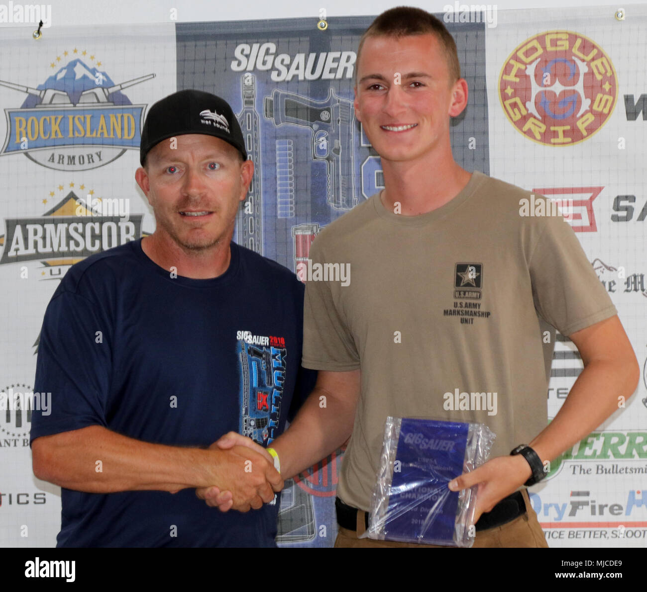 U.S. Army PV2 Nathan Staskiewicz, an Omaha, Nebraska native, accepts